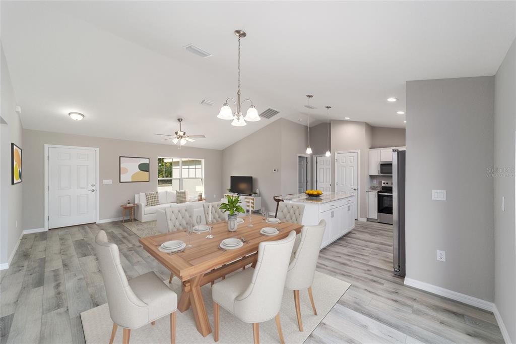 401 West Homeway Loop Citrus Springs, FL 34434 - Photo 7 of 23 a large kitchen with a table and chairs