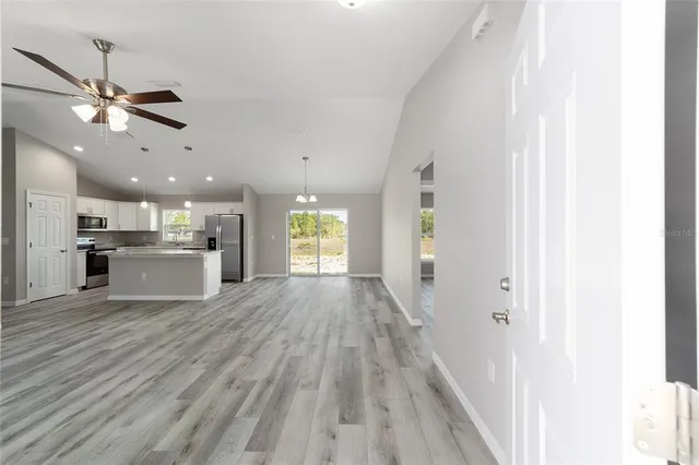 a view of a kitchen with a sink and a window