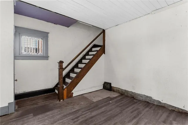 a view of an entryway with wooden floor