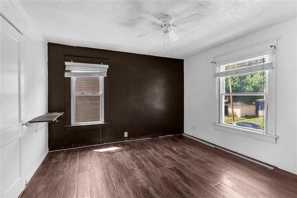 203 Baldwin Avenue Sharon, PA 16146 - Photo 20 of 27 an empty room with wooden floor and windows
