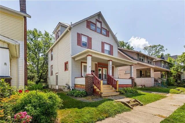 a front view of a house with garden