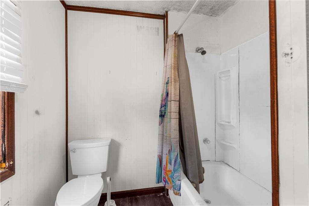 203 Baldwin Avenue Sharon, PA 16146 - Photo 21 of 27 a bathroom with a toilet and a shower