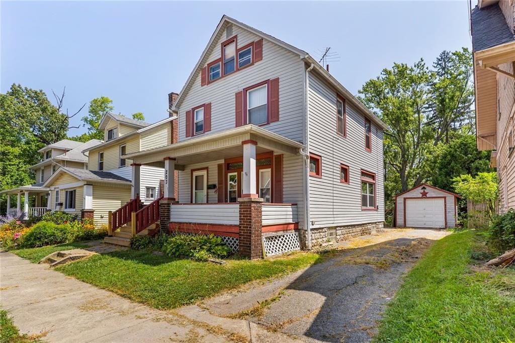 203 Baldwin Avenue Sharon, PA 16146 - Photo 3 of 27 a front view of a house with a garden and plants