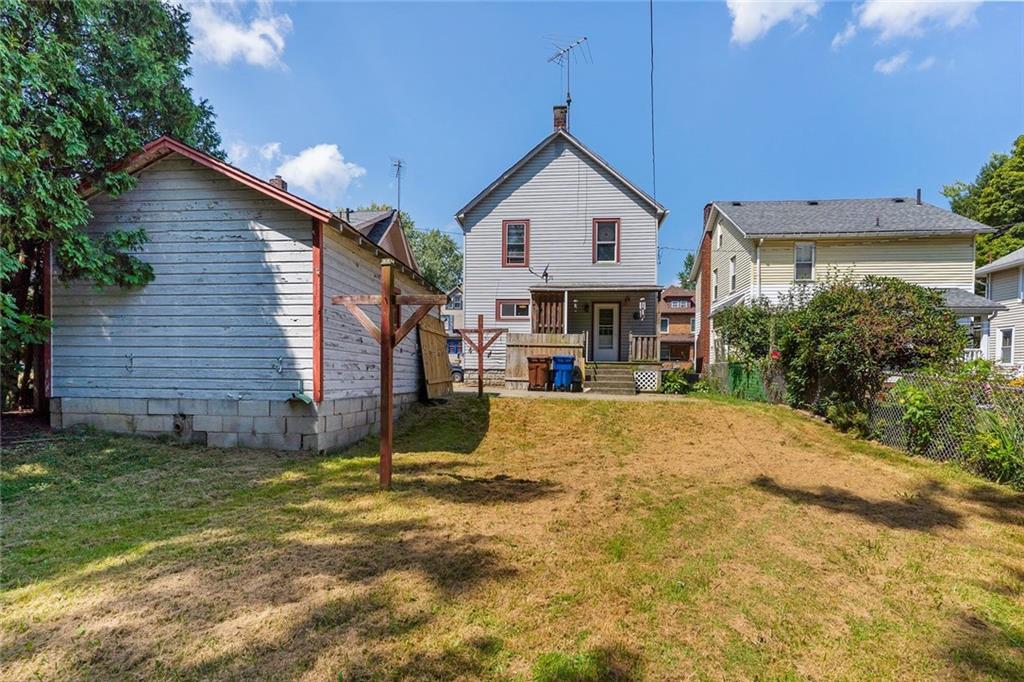 203 Baldwin Avenue Sharon, PA 16146 - Photo 6 of 27 a view of a house with a yard and garage