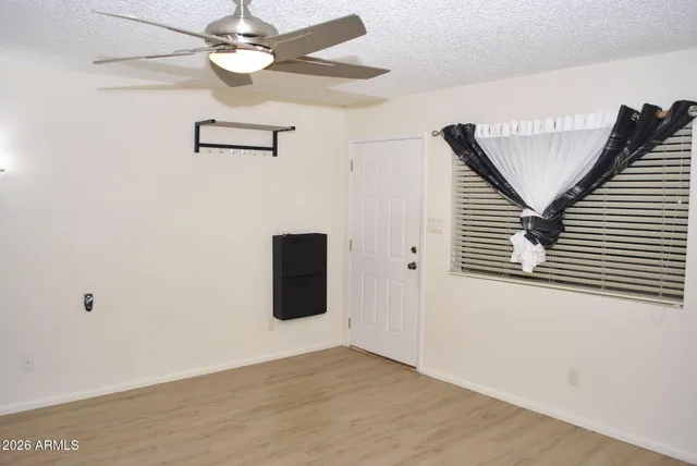 a view of a livingroom with a ceiling fan