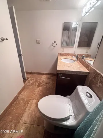 a bathroom with a sink and mirror