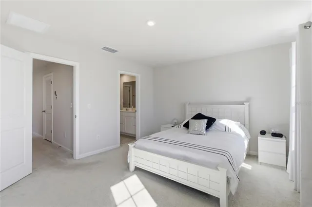 a bedroom with a bed and a cabinets