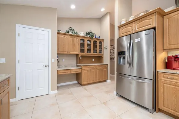 a kitchen with a stove top oven sink and cabinets