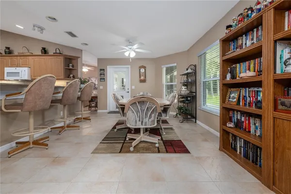 a view of a dining room with furniture and chandelier