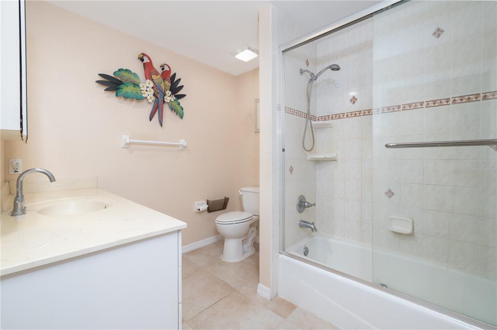 4245 Clinton Cemetery Road Edgewater, FL 32141 - Photo 23 of 60 a bathroom with a bathtub shower sink and toilet