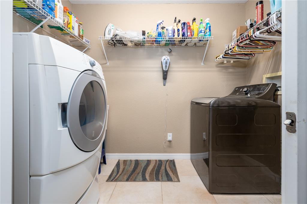 4245 Clinton Cemetery Road Edgewater, FL 32141 - Photo 25 of 60 a utility room with dryer and washer
