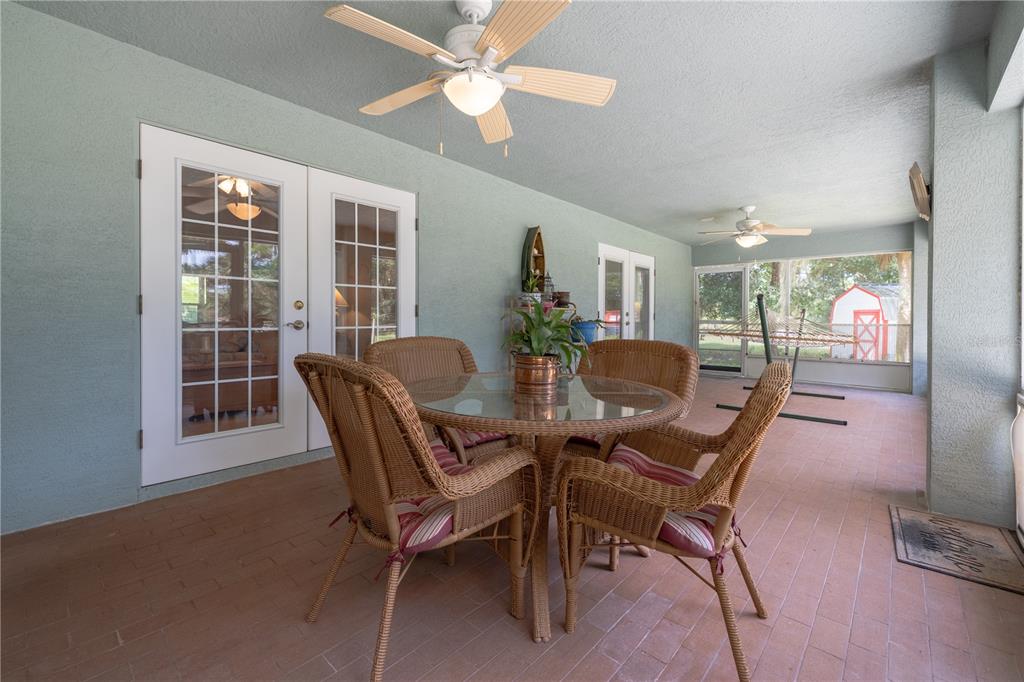 4245 Clinton Cemetery Road Edgewater, FL 32141 - Photo 27 of 60 a view of a dining room with furniture window and wooden floor