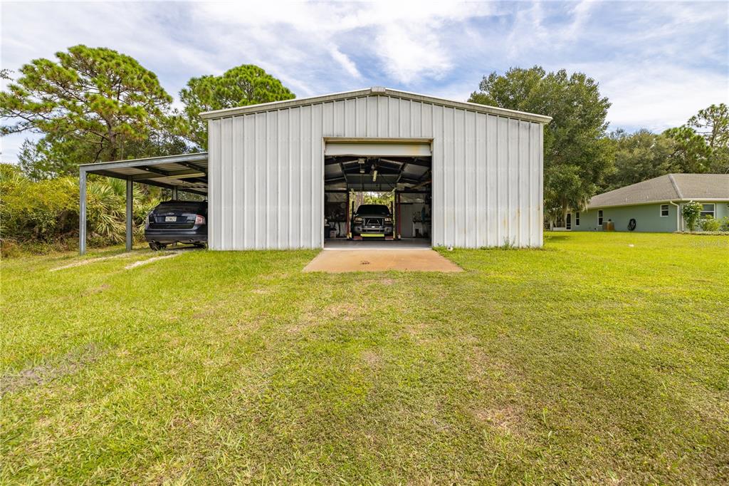 4245 Clinton Cemetery Road Edgewater, FL 32141 - Photo 33 of 60 a view of an house with backyard space and balcony