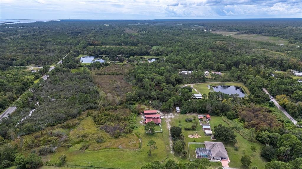 4245 Clinton Cemetery Road Edgewater, FL 32141 - Photo 50 of 60 an aerial view of house with yard and mountain view in back