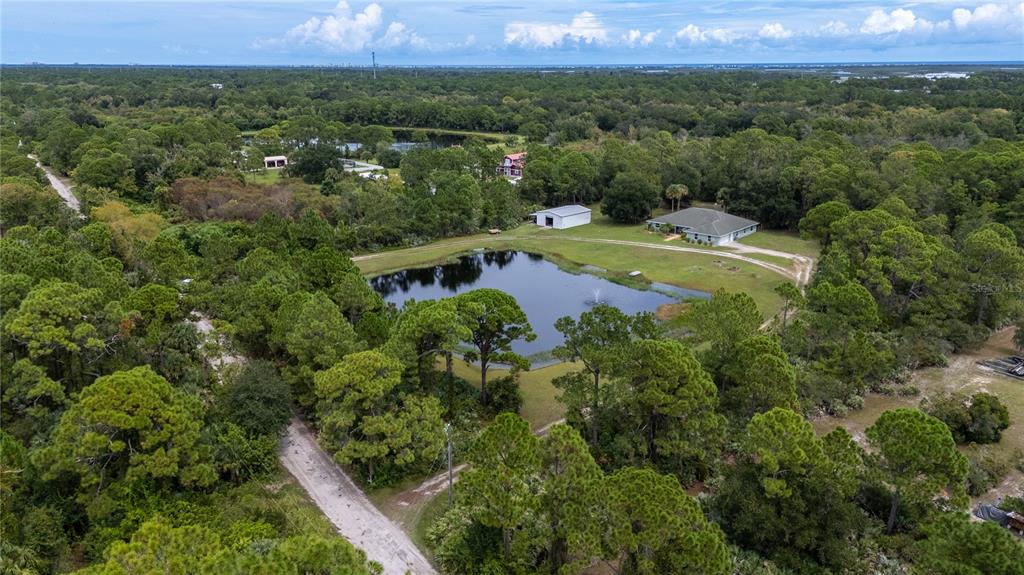 4245 Clinton Cemetery Road Edgewater, FL 32141 - Photo 55 of 60 an aerial view of a house with a yard
