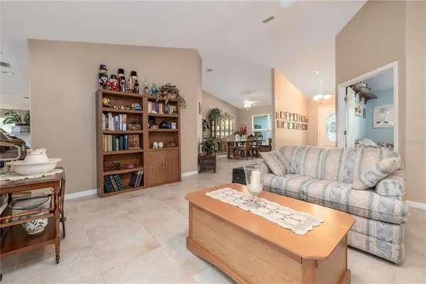 a view of a livingroom with furniture and a ceiling fan