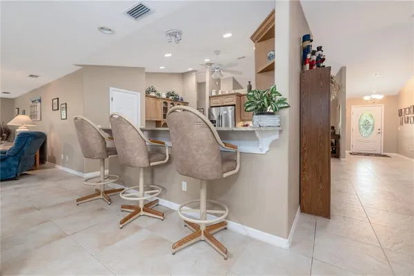 a kitchen with stainless steel appliances a refrigerator and a stove top oven
