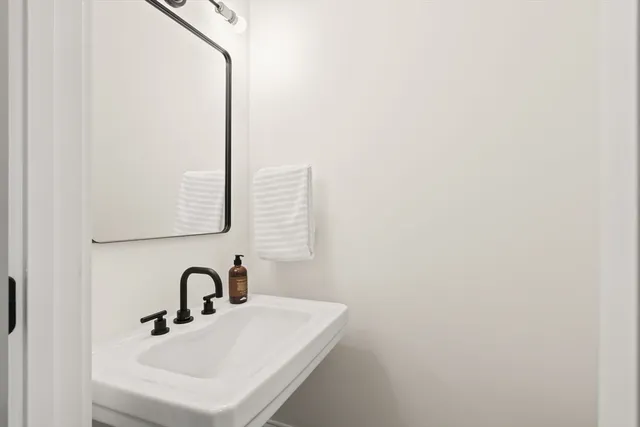 a bathroom with a sink and mirror