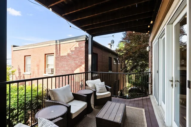 a outdoor living space with patio furniture and a potted plant