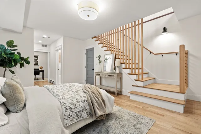 a bedroom with a bed and a television