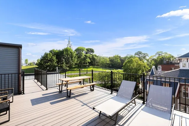 a view of a terrace with wooden benches