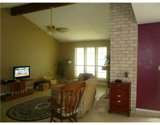 a bed room with a bed and a window