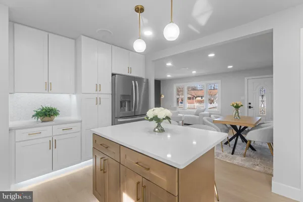 a view of kitchen island a sink and living room