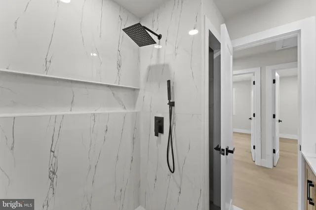 a kitchen with a refrigerator sink and cabinets