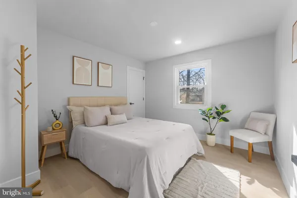 a bedroom with a bed and a couch