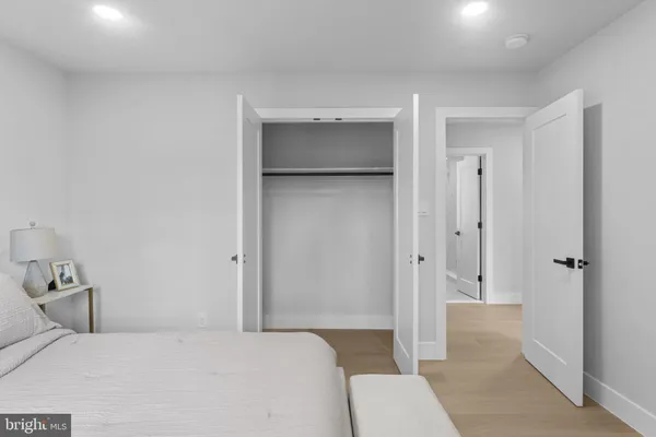 a bedroom with a bed and a toilet