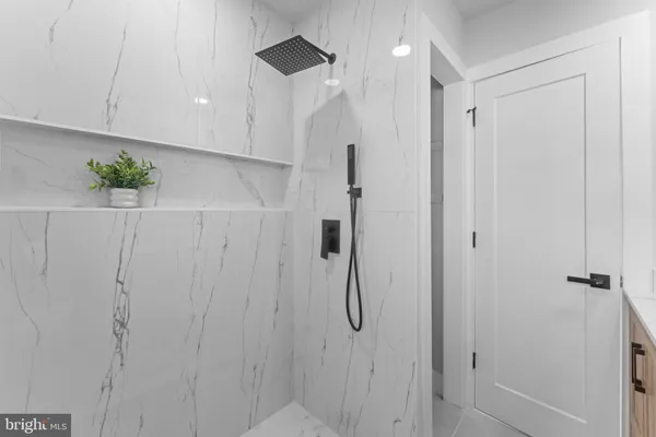 a bathroom with a shower and a shower