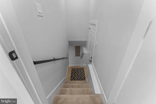 a view of a hallway view with staircase