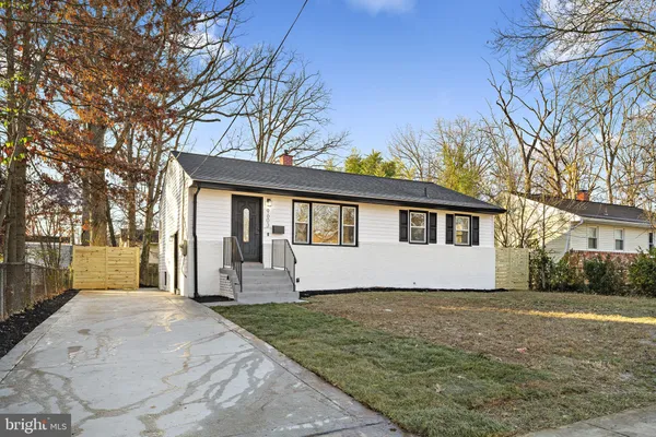 a house with trees in the background