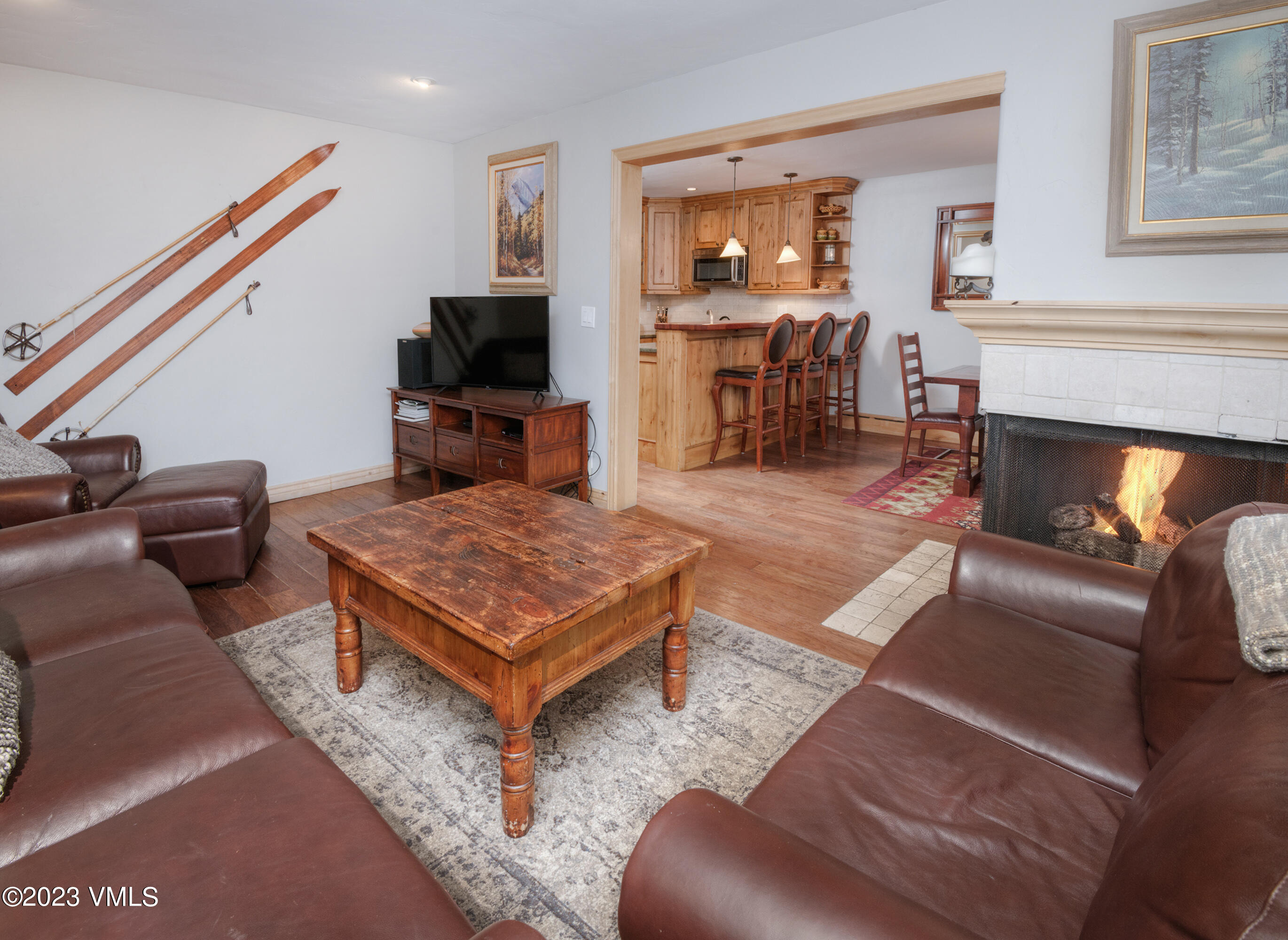 442 South Frontage Road East, Unit 103B Vail, CO 81657 - Photo 11 of 32 a living room with furniture and a fireplace