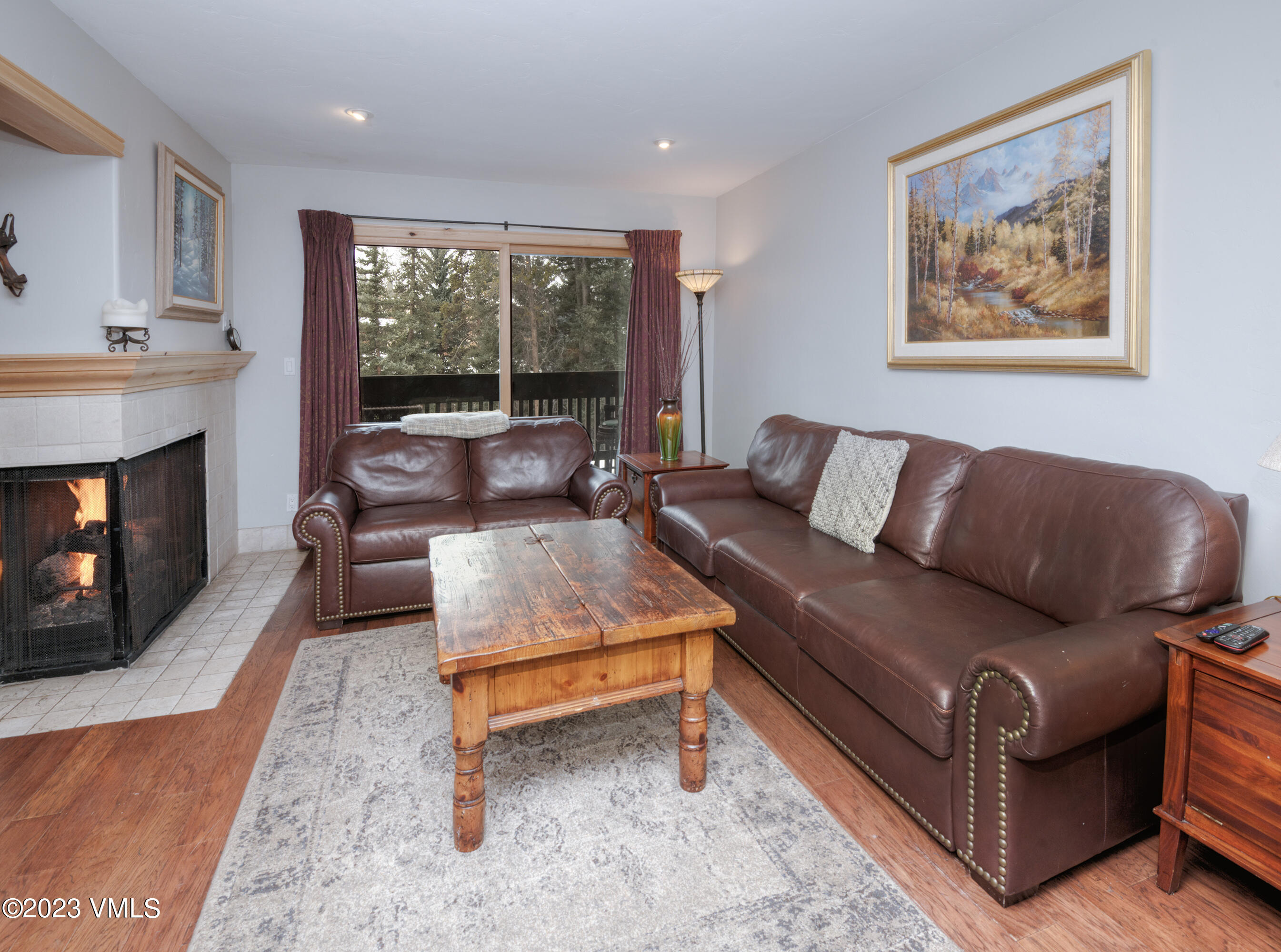 442 South Frontage Road East, Unit 103B Vail, CO 81657 - Photo 12 of 32 a living room with furniture and a fireplace