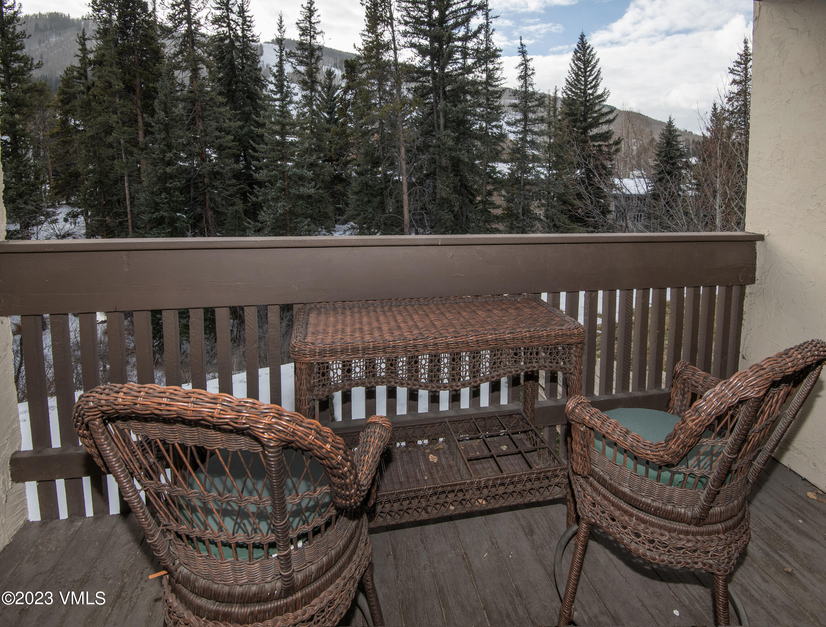 442 South Frontage Road East, Unit 103B Vail, CO 81657 - Photo 21 of 32 a view of a chair and table in the balcony