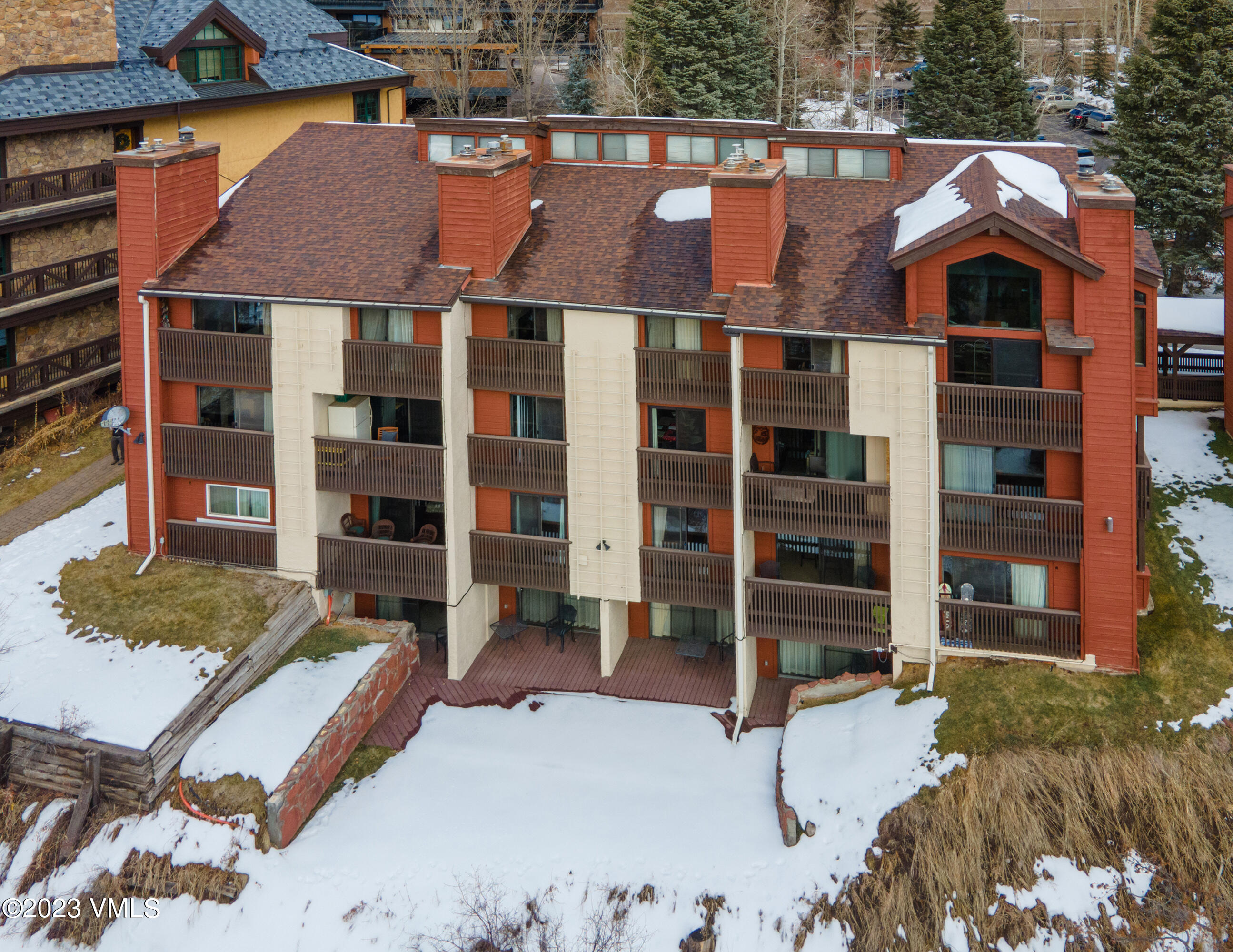 442 South Frontage Road East, Unit 103B Vail, CO 81657 - Photo 32 of 32 front view of a house with a yard