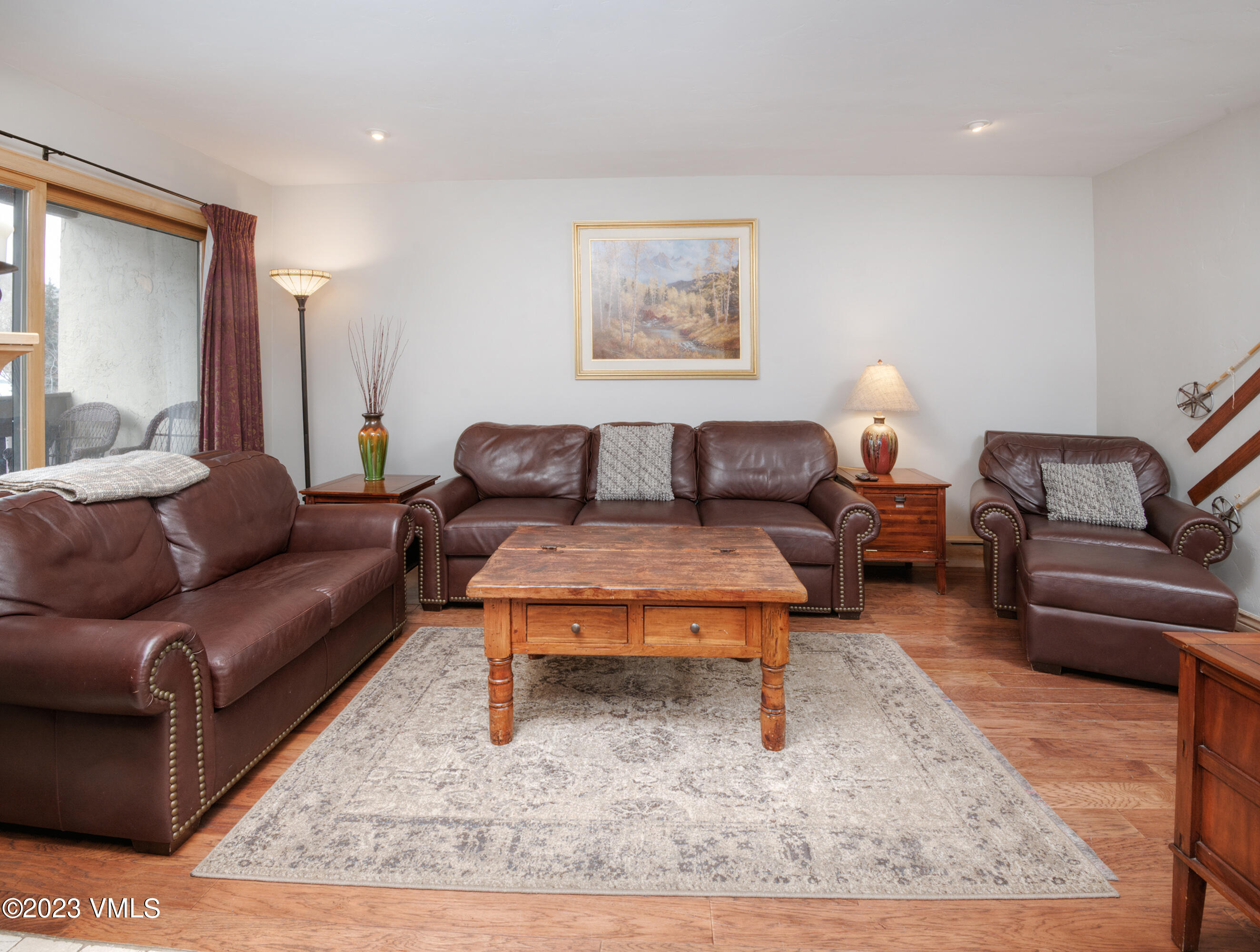 442 South Frontage Road East, Unit 103B Vail, CO 81657 - Photo 10 of 32 a living room with furniture and a rug