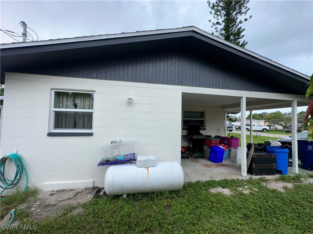 2196 Barry Drive Fort Myers, FL 33907 - Photo 16 of 17 a backyard of a house with seating space