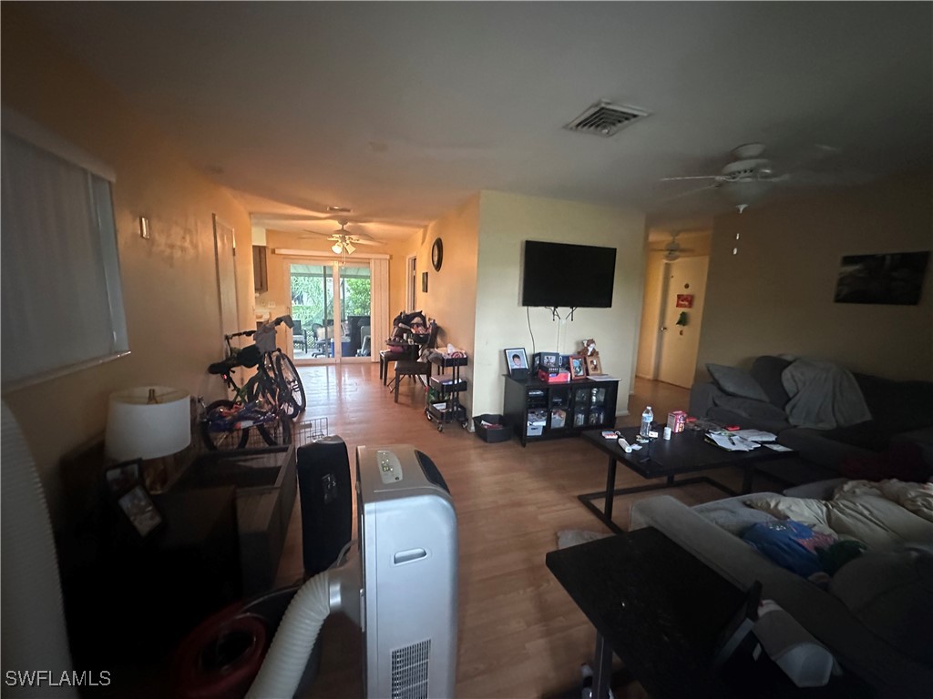 2196 Barry Drive Fort Myers, FL 33907 - Photo 3 of 17 a living room with furniture floor and a flat screen tv