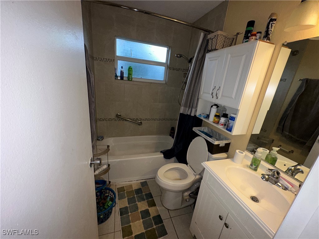 2196 Barry Drive Fort Myers, FL 33907 - Photo 9 of 17 a bathroom with a sink toilet and shower