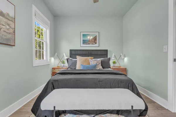 a bedroom with a bed and window