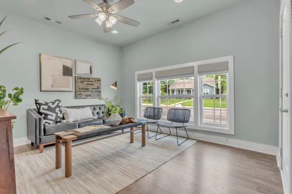 a living room with furniture and a window