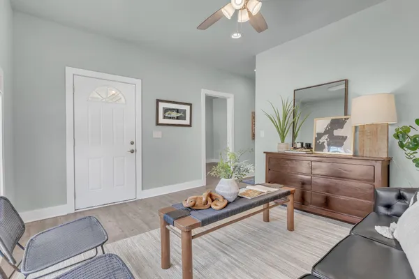 a living room with furniture and a table