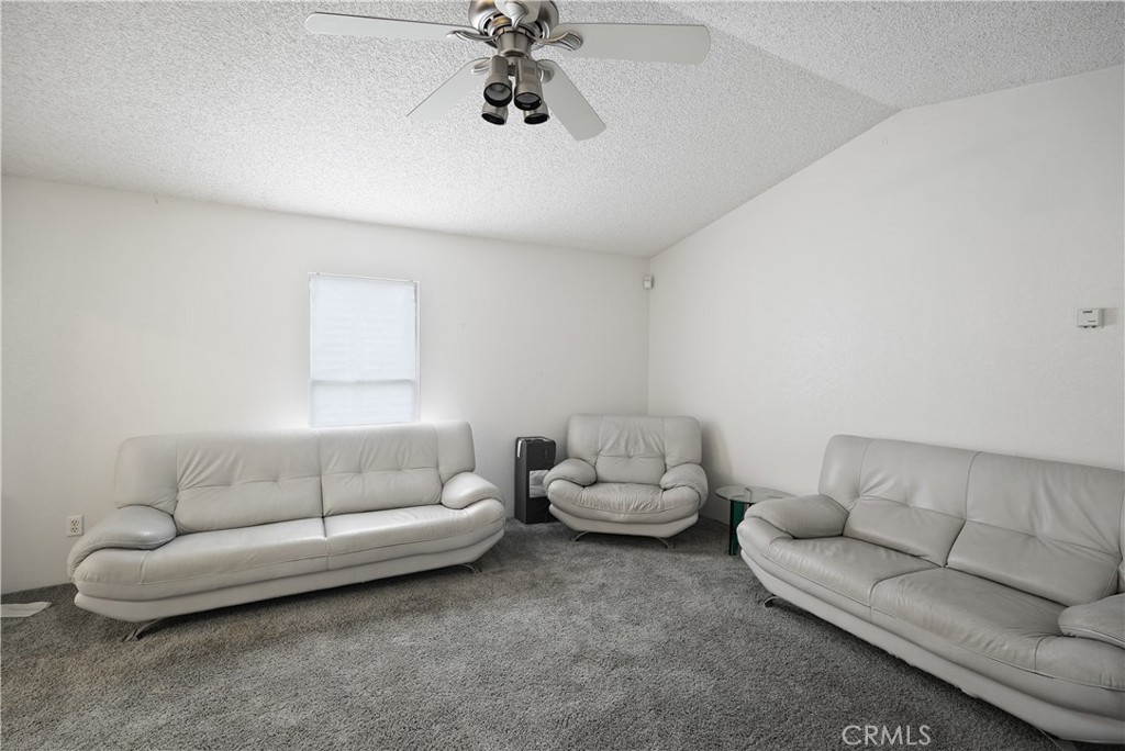18420 Decker Road Perris, CA 92570 - Photo 12 of 26 a living room with furniture and a couch