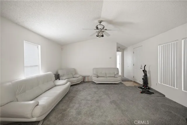 a white refrigerator freezer and a stove sitting inside of a kitchen