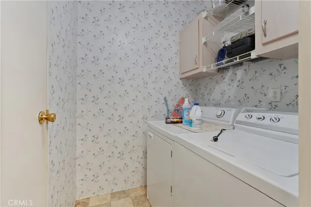 a kitchen with stainless steel appliances granite countertop a sink and a stove