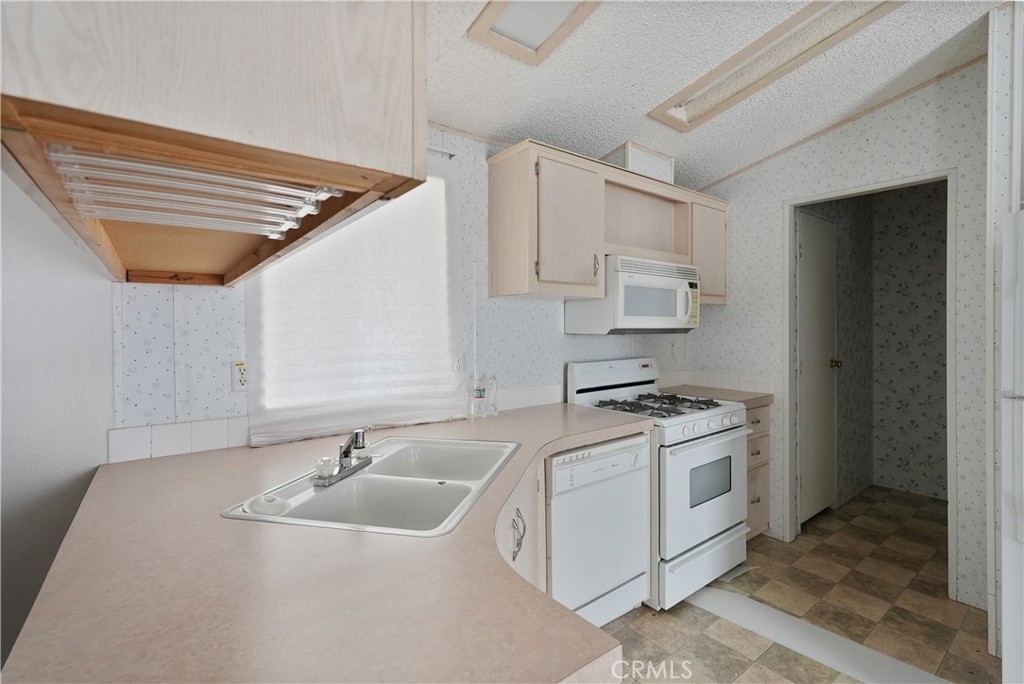 18420 Decker Road Perris, CA 92570 - Photo 17 of 26 a kitchen with stainless steel appliances granite countertop a sink and a stove