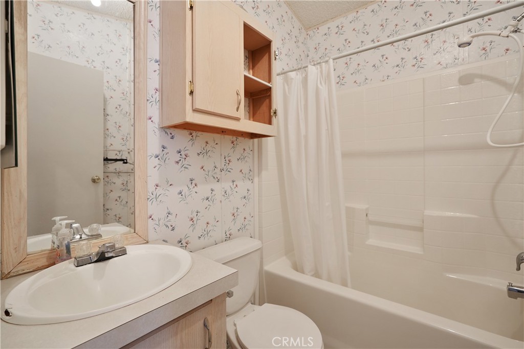 18420 Decker Road Perris, CA 92570 - Photo 9 of 26 a bathroom with a sink toilet and shower