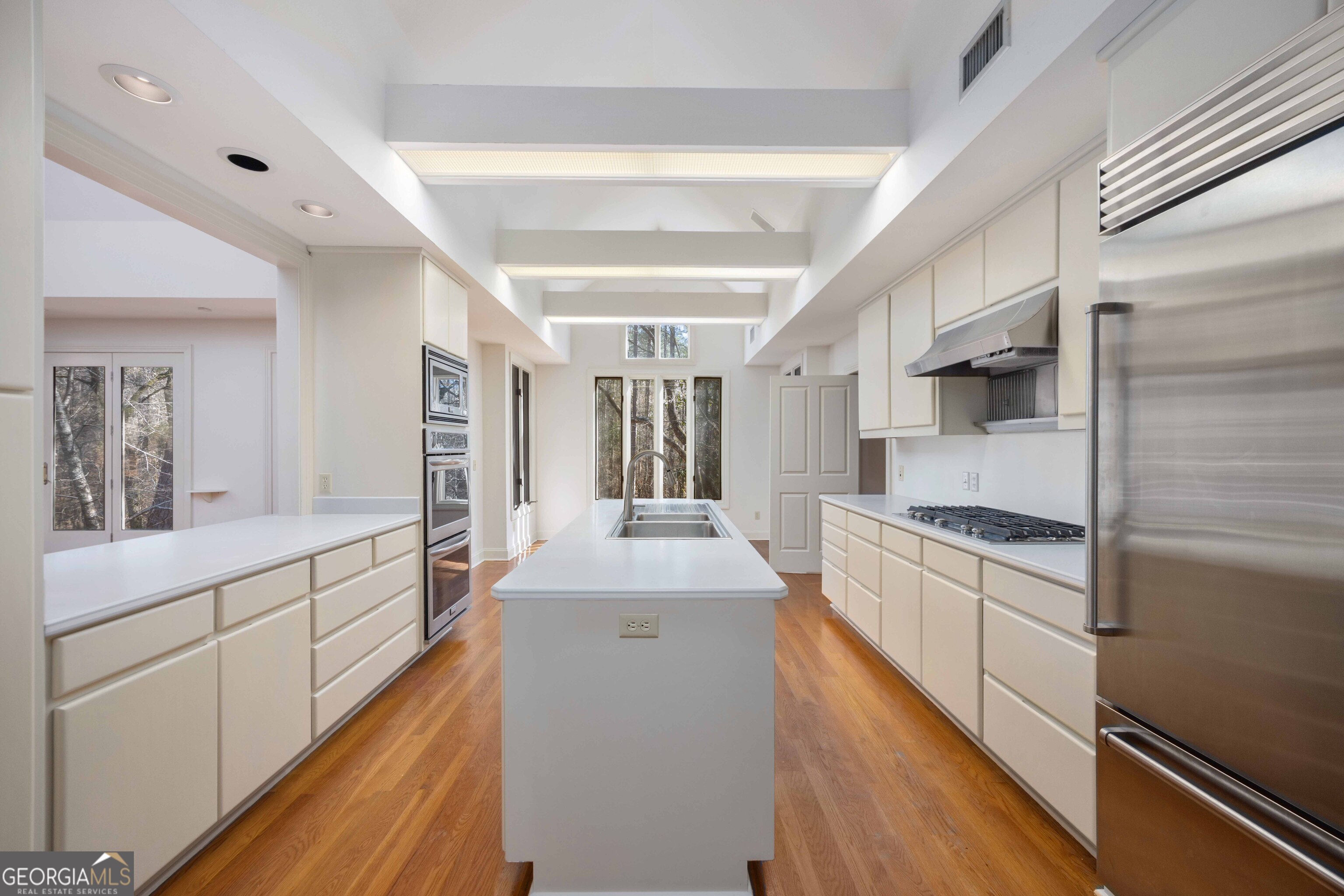 4 Mountain Ridge Court Columbus, GA 31904 - Photo 13 of 74 a large kitchen with stainless steel appliances granite countertop a lot of counter space and wooden floors